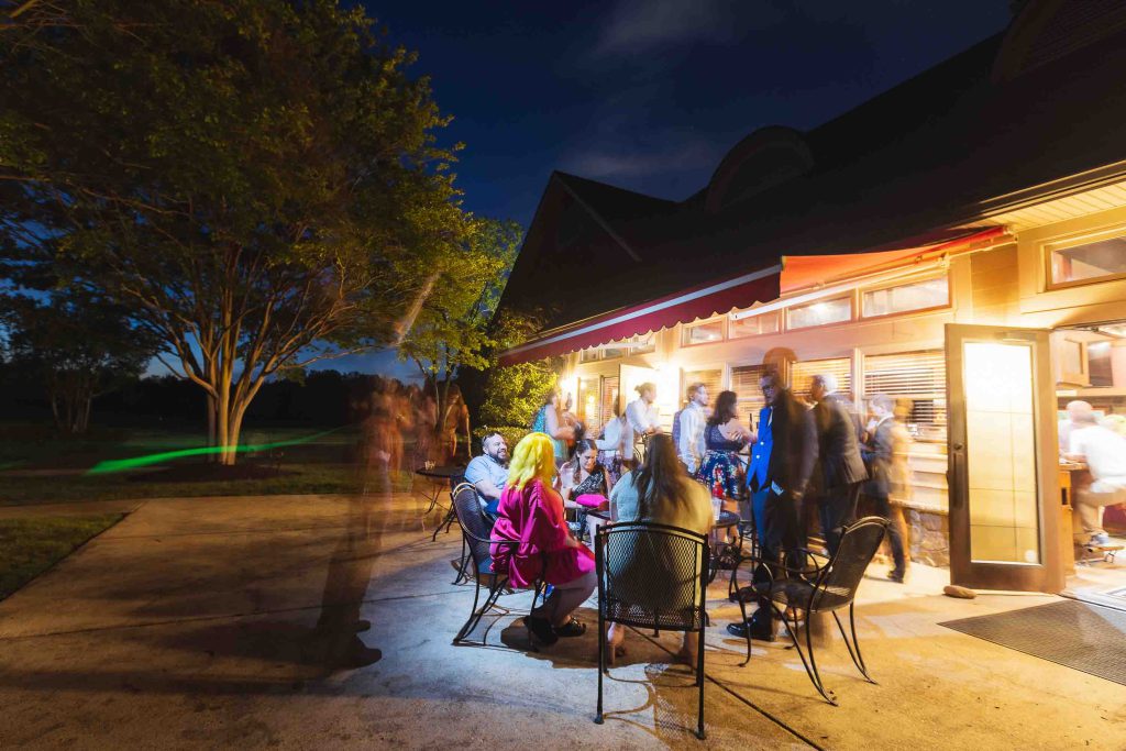 A wedding reception at a restaurant at night.