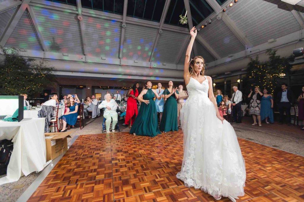 A bride is dancing at a wedding reception.