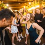 A group of people dancing at a quinceanera.
