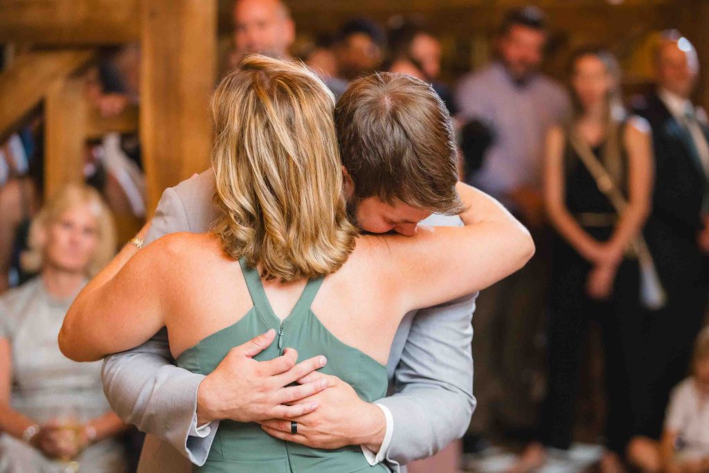 A couple embracing during their wedding reception.