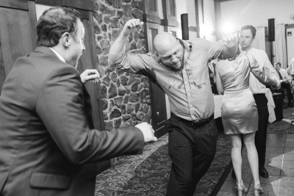 A group dancing at a wedding reception.