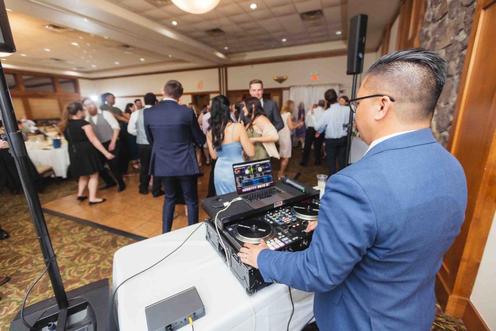 A DJ performing at a wedding reception.