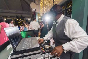 A DJ performing at a wedding reception.