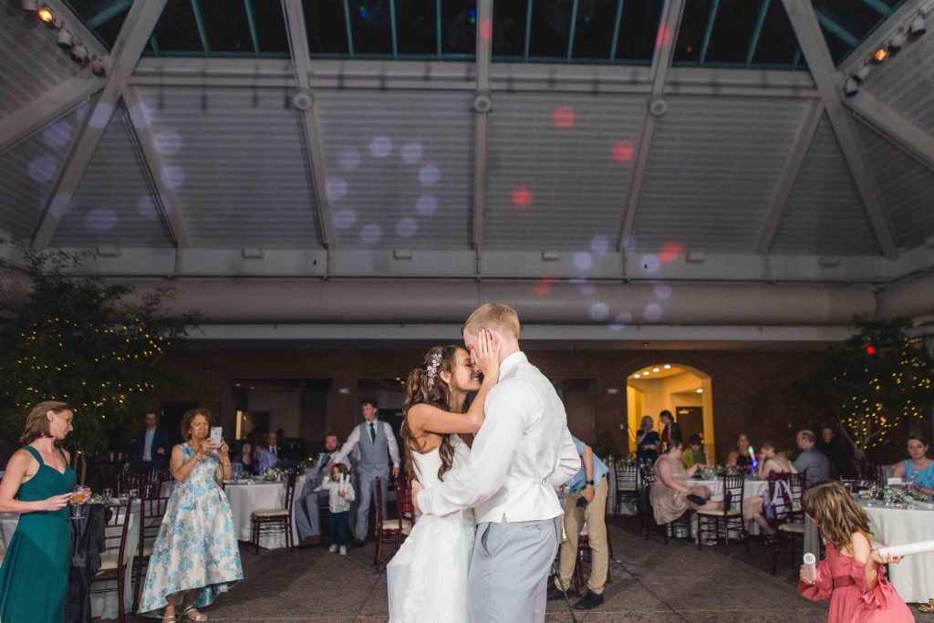 A couple's first dance occurs at their wedding reception.