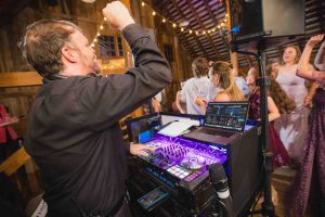 A DJ performing at a wedding reception.