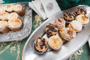 Several wedding cupcakes on a silver platter at Savage Mill.