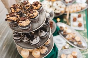 Cupcakes are on display at a wedding reception held in Savage Mill.