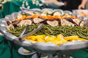 A Savage Mill wedding with a buffet of vegetables and green beans incorporated into the intricate details.