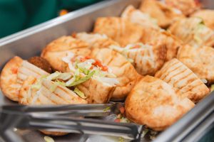 A tray of food on a table with a fork at Savage Mill, Wedding.