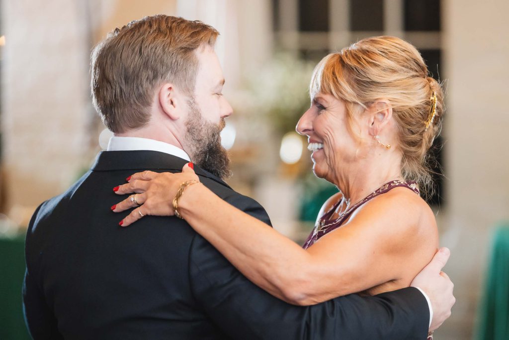 A man and woman sharing a dance at a wedding reception held at Savage Mill.
