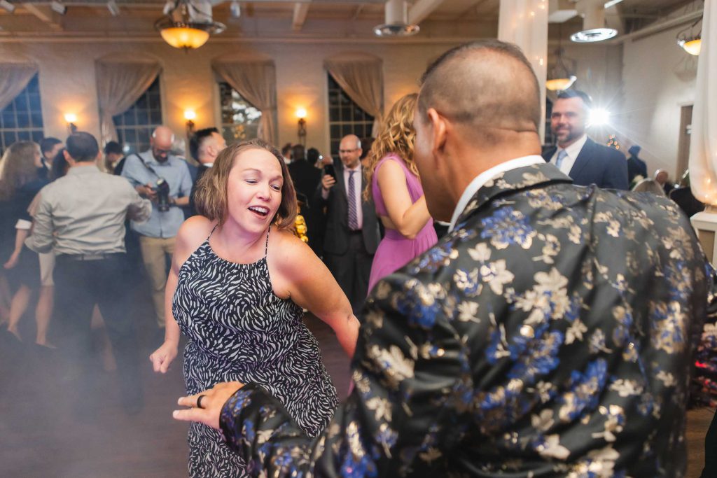 A man and woman dancing at a wedding reception held at Savage Mill.