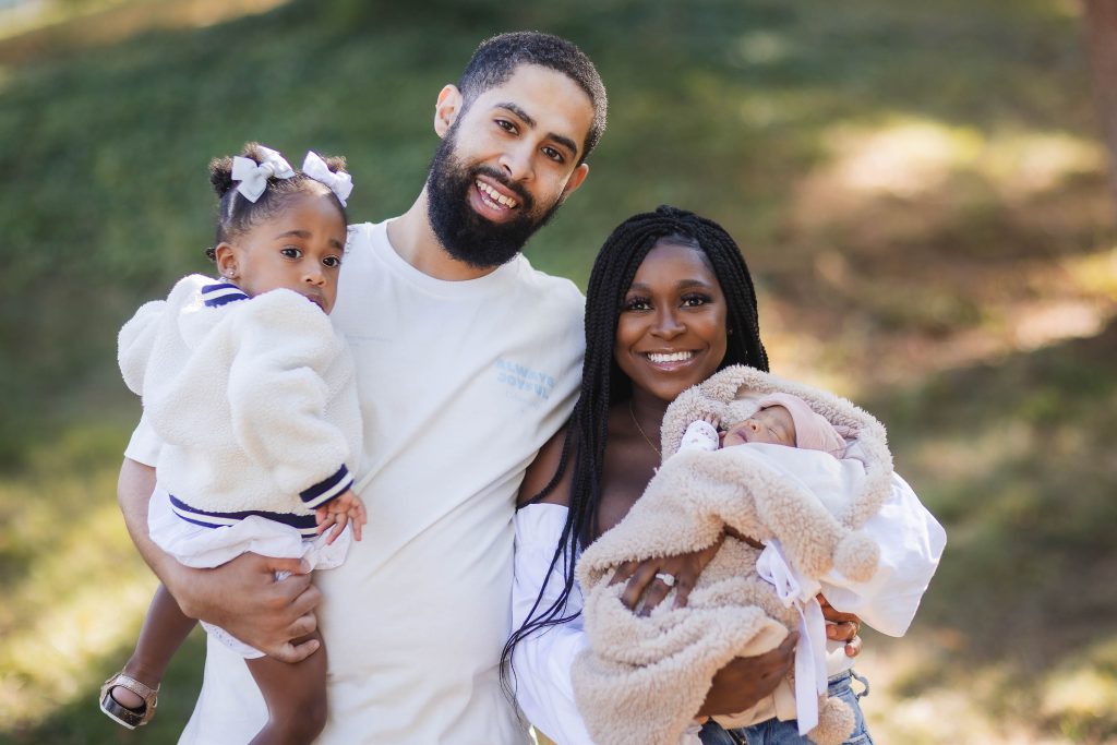 A newborn joins a family in their home for an intimate portrait.