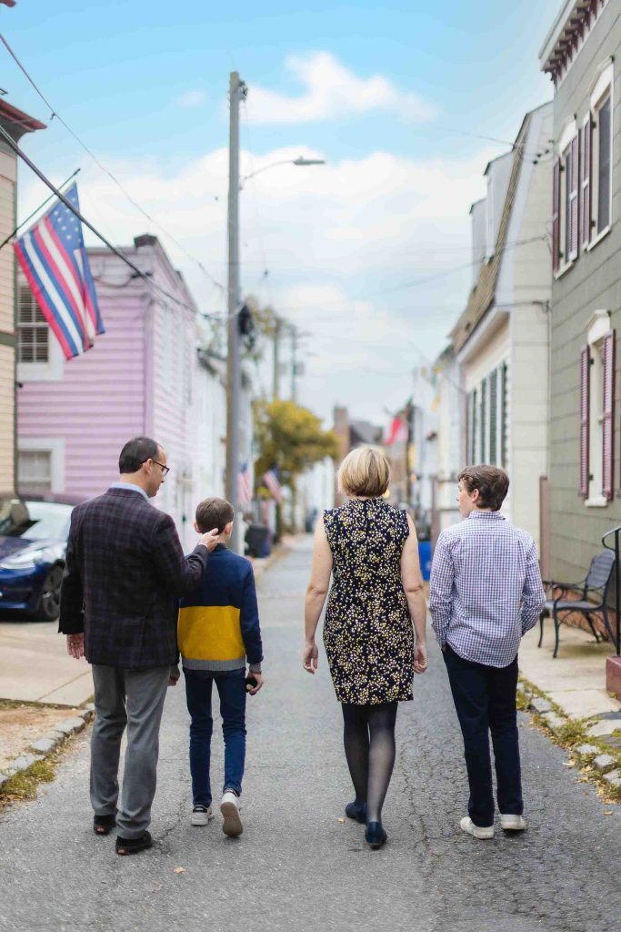 A family walking down a street in downtown Annapolis.