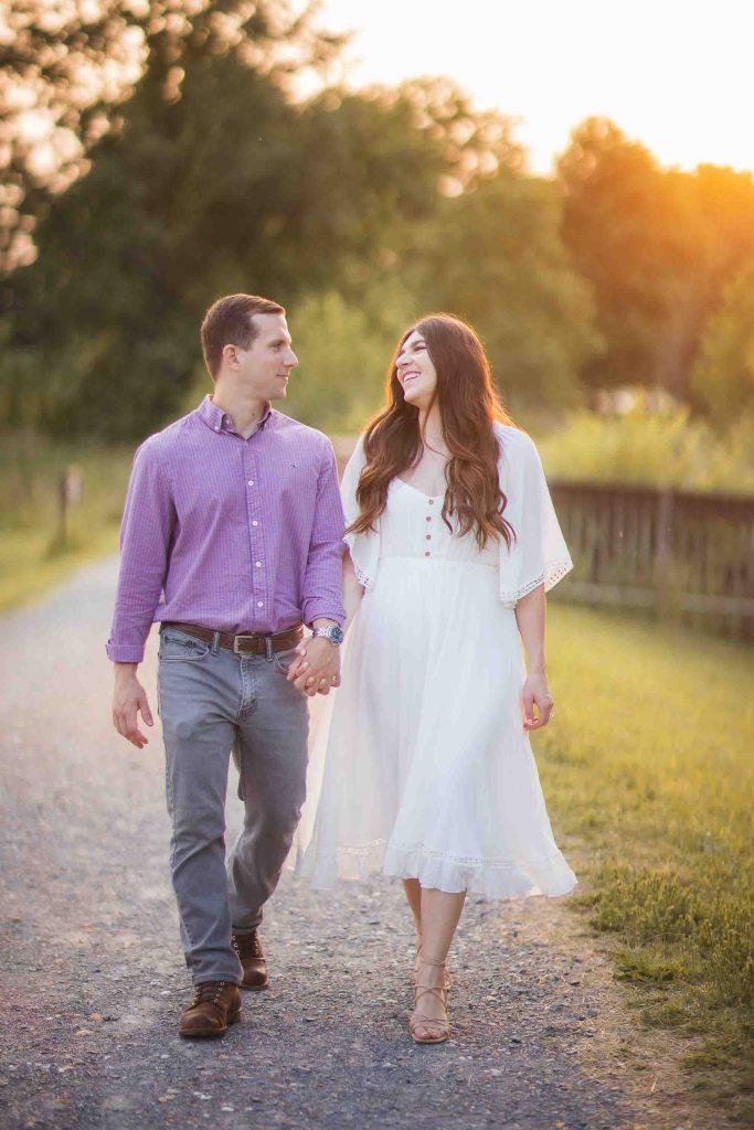 An engaged couple taking romantic sunset engagement photos at Patuxent Research Refuge.