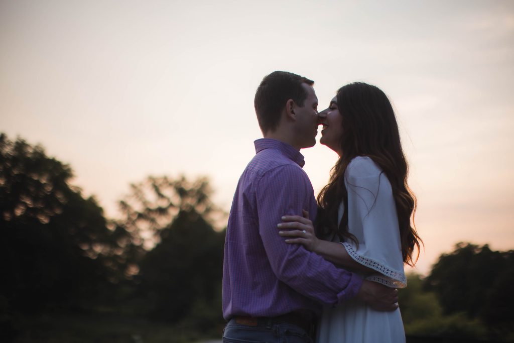 Engagement Photos of a couple kissing at sunset in Maryland.