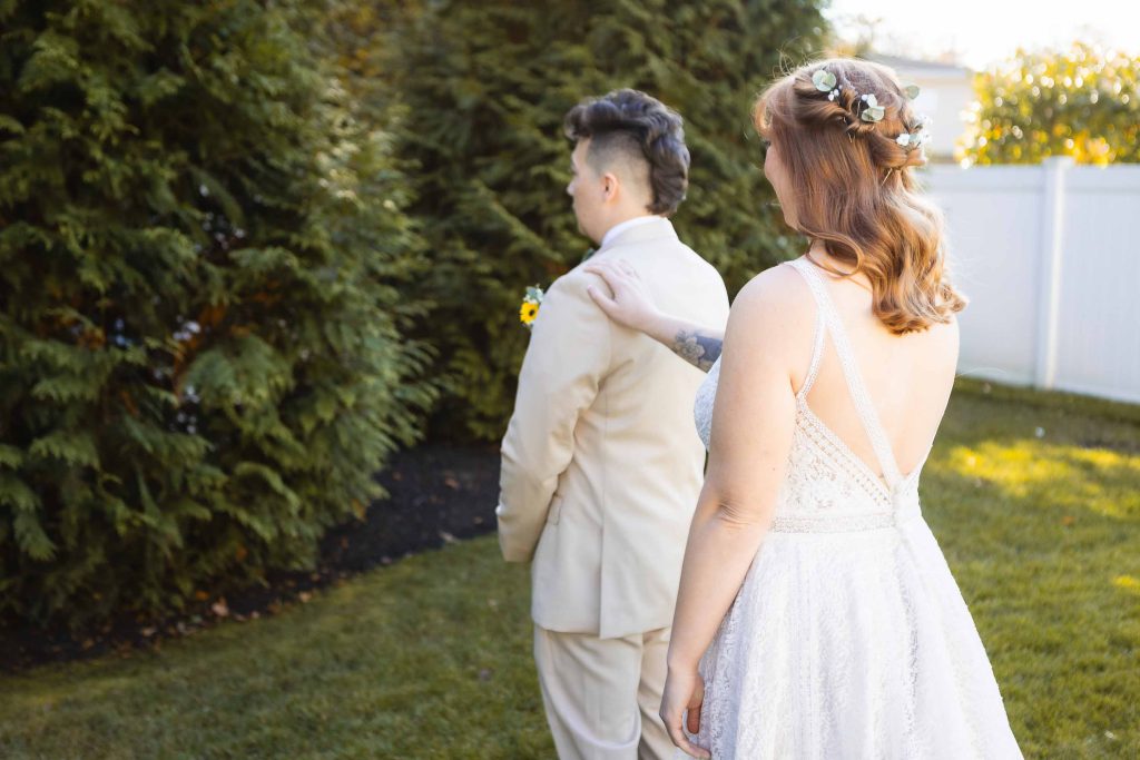 A couple's heartfelt First Look at each other in the stunning Blackwall Barn & Lodge for their beautiful wedding ceremony in a backyard setting.
