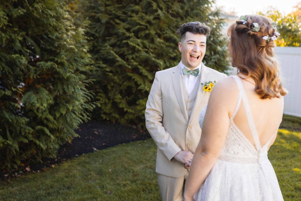 A bride and groom sharing their first look at each other in the serene backyard of Blackwall Barn & Lodge on their wedding day.