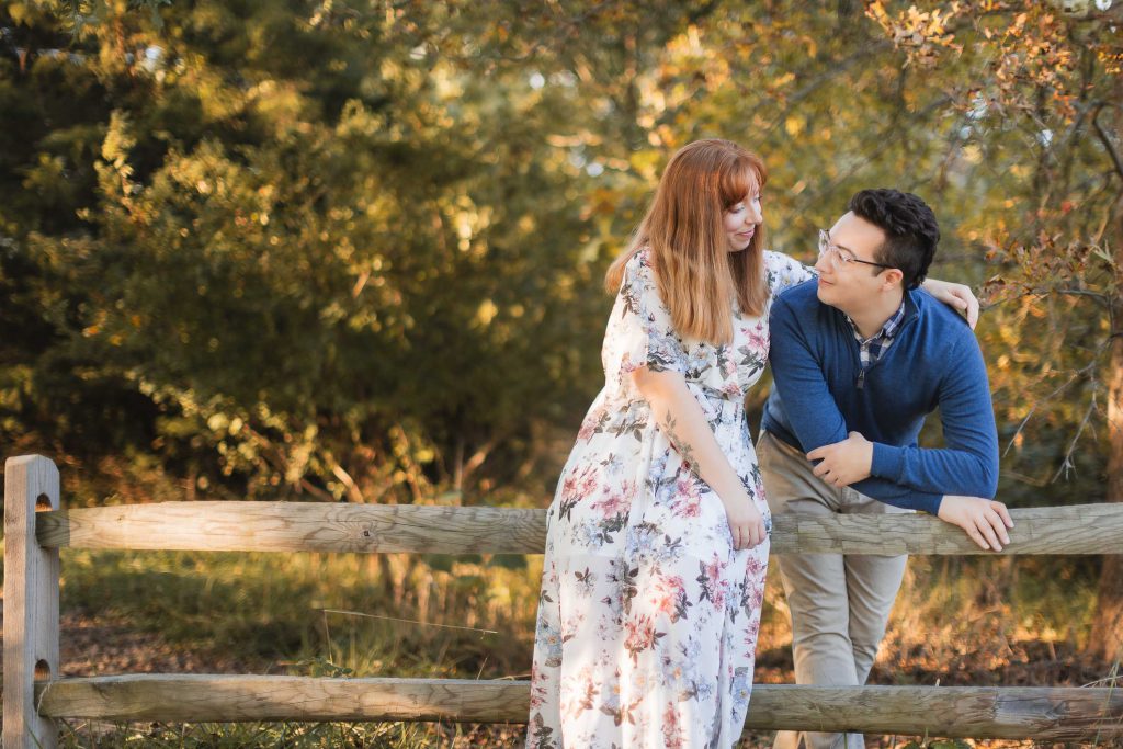 A couple standing at Patuxent Research Refuge during their engagement session.