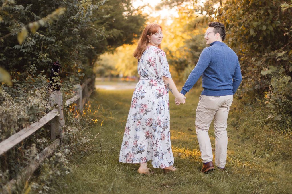 A couple embracing in the beautiful Patuxent Research Refuge during their engagement session.