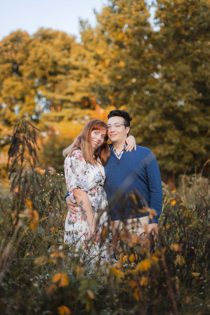 An engaged couple posing in the romantic Patuxent Research Refuge for their engagement portraits.