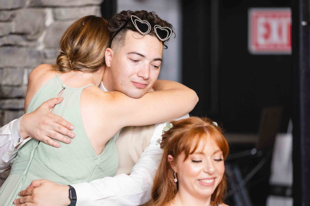 A bride and groom hugging each other at their Blackwall Barn & Lodge wedding reception.