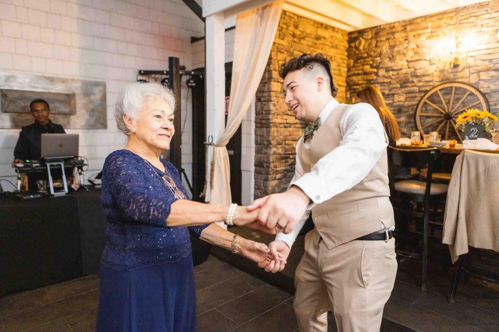 A man and an older woman dancing at a wedding reception at Blackwall Barn & Lodge.