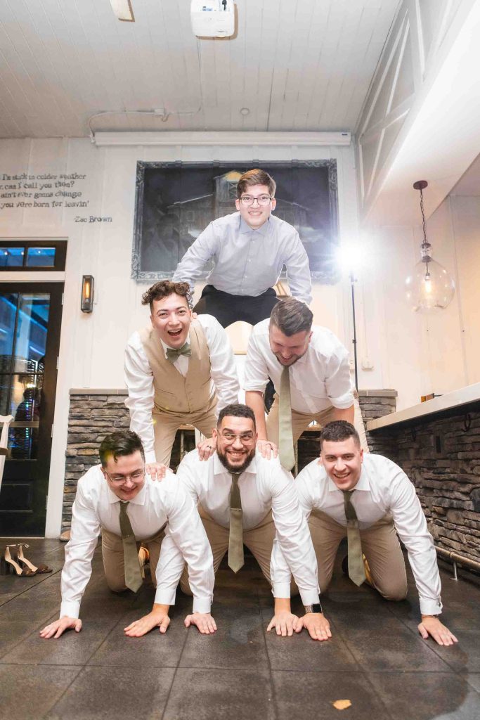 A group of groomsmen posing for a wedding photo at the Blackwall Barn & Lodge.