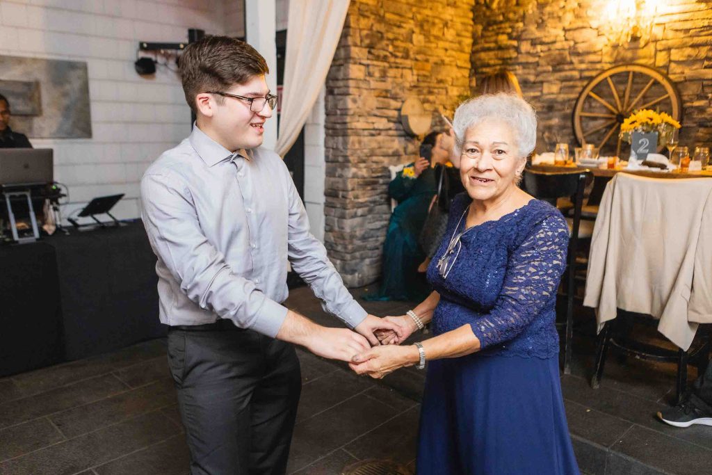 A man and woman gracefully dancing at a Blackwall Barn & Lodge wedding reception.