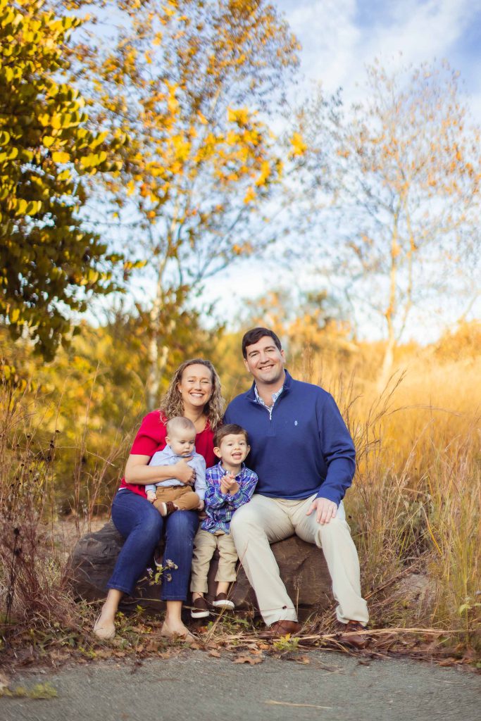 A family is posing for a family portrait in Annapolis, Maryland.