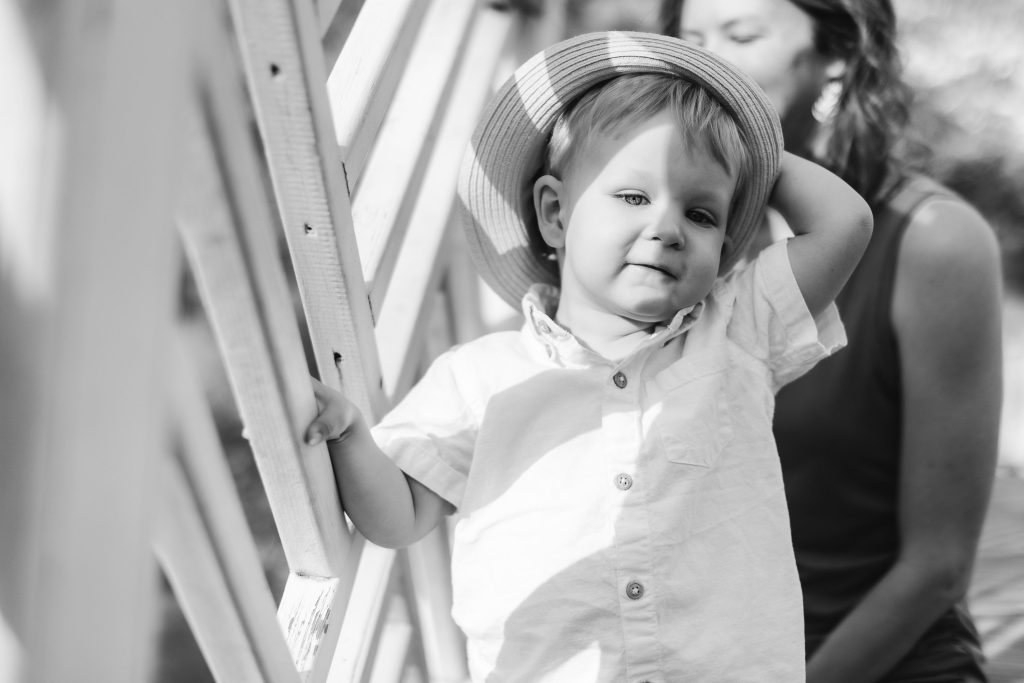 A black and white photo of a woman holding a child at Quiet Waters Park.