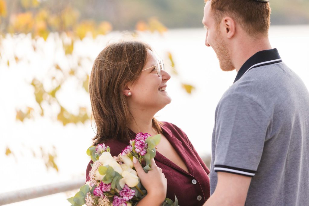 A couple looking at each other while holding flowers in Washington DC.