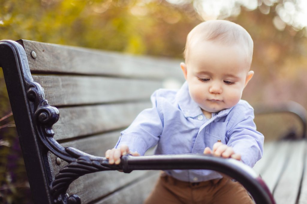 A boy is playing on a park bench at Quiet Waters Park in Annapolis, Maryland.