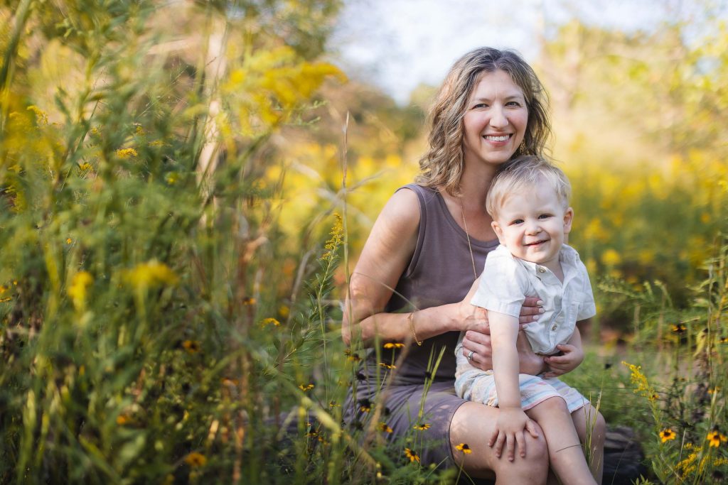 A family poses for a portrait in a field of wildflowers in Annapolis.