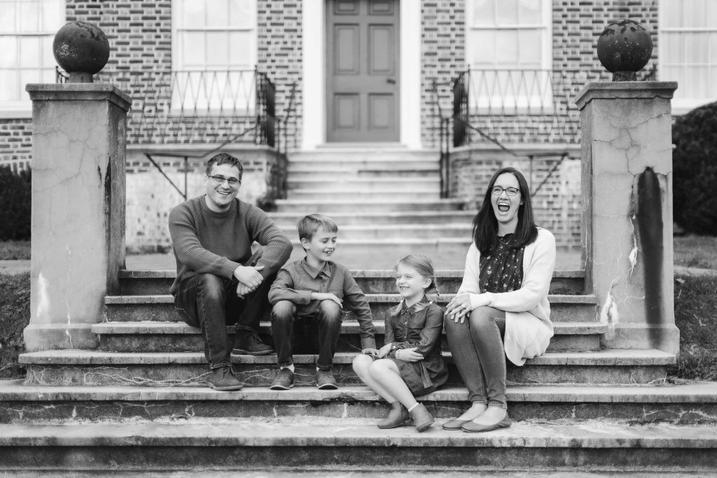 A photo of a Family sitting on steps at Belair Mansion in Bowie, Maryland.