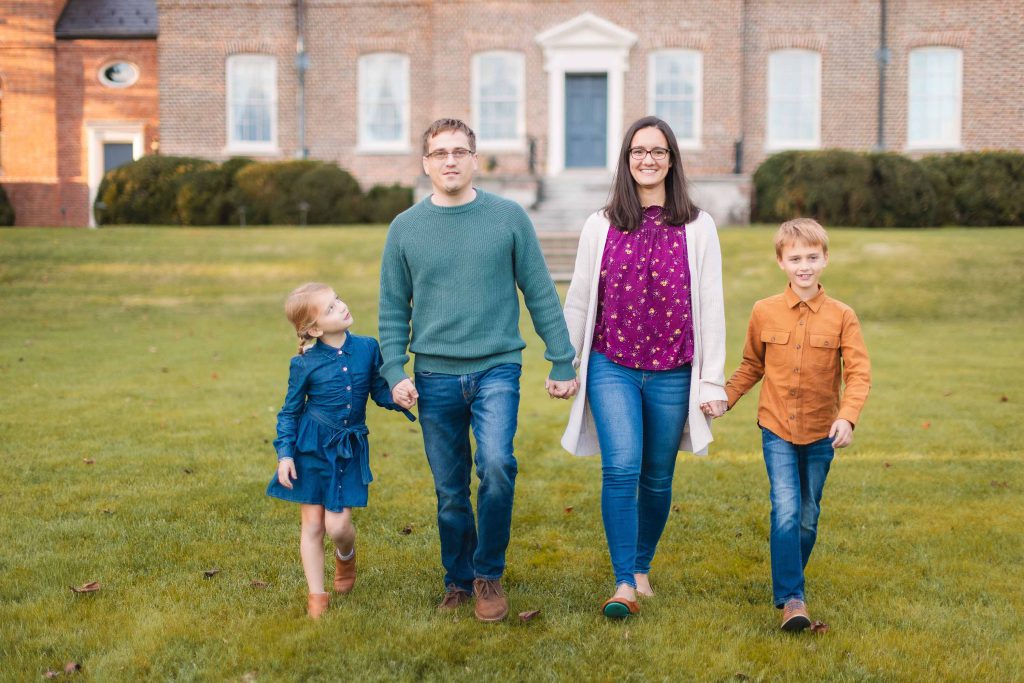 A Family portrait in front of a large brick house in Bowie, Maryland.